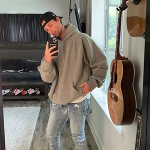 Men’s Fear of God Essentials Heather Oat Pullover Hoodie worn by Noah